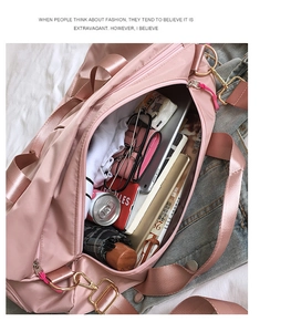 Pink waterproof nylon gym bag showing large capacity for laptop and travel essentials
