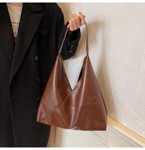 Brown vintage hobo bag details showing high-quality leather texture and minimalist design