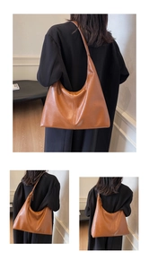 Brown leather hobo tote bag worn by a model, showing the large capacity and soft texture