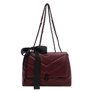 Chic burgundy chevron quilted shoulder bag with large black bow and chain strap