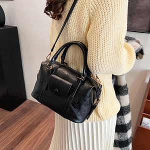 Retro black Boston style pillow bag in PU leather with adjustable crossbody shoulder strap