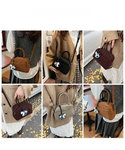 Mini matte bowling bag shown in various colors on models with autumn vibes