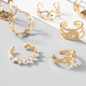 Detailed view of 14K gold-plated rings set featuring elegant pearls and zircon accents