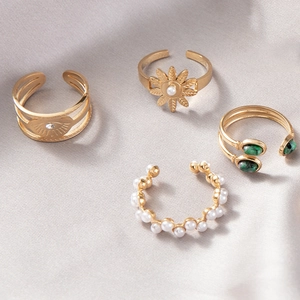 Set of 4 gold-plated open rings with pearl, turquoise stone and evil eye accents