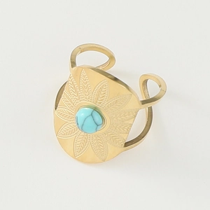 Detail of wide gold ring with blue turquoise stone and engraved petal patterns