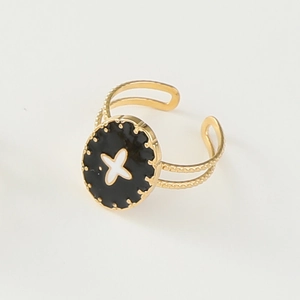 Detail of 14K gold-plated ring featuring black enamel star and dotted decorative edges