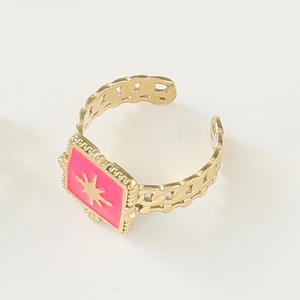 Detail of 14K gold plated adjustable ring with pink enamel star and cutout chain band