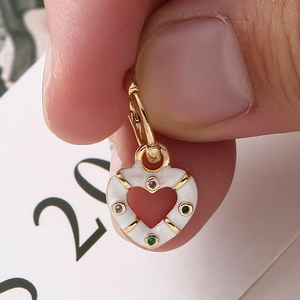18K gold-plated heart earring featuring white enamel and colorful inlaid crystals