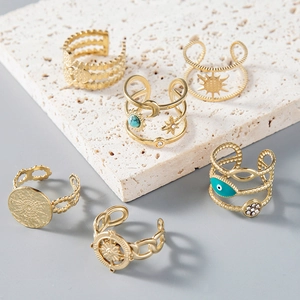 Bohemian gold stainless steel ring set with sun, moon, and evil eye motifs