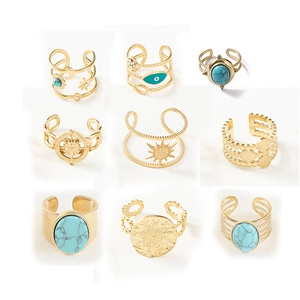 Gold bohemian evil eye ring set with turquoise inlay and celestial relief patterns