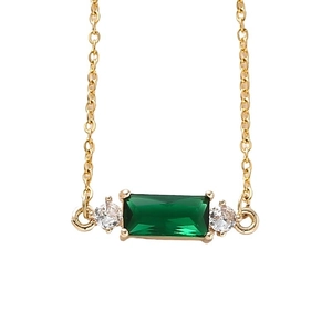 Elegant gold chain necklace featuring a rectangular emerald green stone and small diamonds