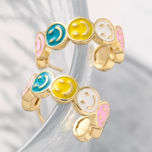 Colorful drip oil smiley face drop earrings with golden base on frosted glass edge