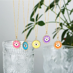 Colorful evil eye necklaces in pink blue yellow purple and orange with gold chain