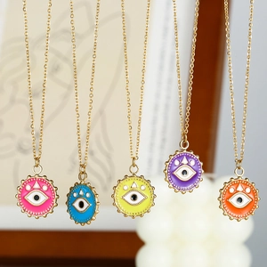 Five colorful enamel evil eye pendant necklaces in gold finish with delicate chain links