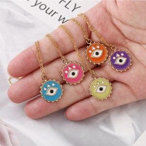 Golden stainless steel evil eye pendant necklace set in five vibrant enamel colors