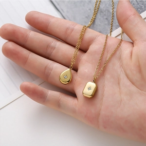 Gold layered necklaces with teardrop and rectangular pendants featuring star-set zircon