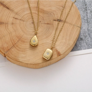 Minimalist gold teardrop and rectangle necklaces with starburst engraving and small zircon