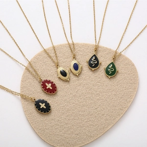 Retro gold pendant necklaces with colorful enamel cross star and snake motifs