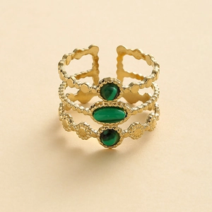 Detailed view of bohemian gold stainless steel ring with three green malachite stones