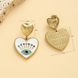 Golden heart earrings with white enamel evil eye and colorful rhinestones display