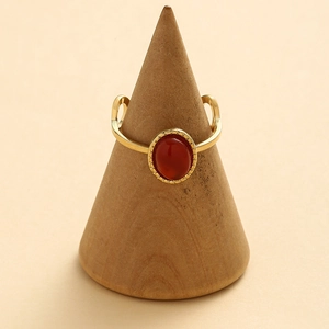 Gold stainless steel ring with an oval red natural stone and a vintage textured band
