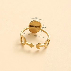 Golden stainless steel oval ring with Venus and Mars symbols on a minimalist band