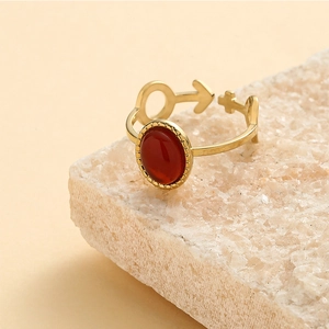 Golden stainless steel ring with red oval natural stone and celestial symbol details