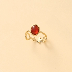 Gold adjustable ring with oval red stone and symbolic venus engraving on the band