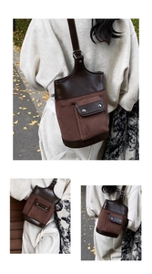 Detail of vintage contrast suede and leather bucket bag with metal hardware buckle