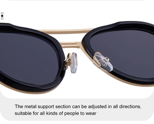 Detail of adjustable silicone nose pads and golden double bridge on metal sunglasses