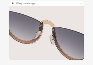 Détail du pont de nez doré ondulé et verres dégradés sans monture sur lunettes de soleil