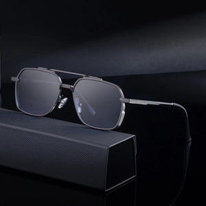 Men's square double-bridge gunmetal sunglasses resting on a premium black textured case