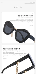 Détail de lunettes de soleil œil de chat avec pont doré et pendentifs originaux