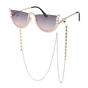 Lunettes de soleil œil de chat sans monture avec strass et chaîne à étoiles