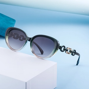 Fashionable cat eye polarized sunglasses with unique chain temples and green gradient lenses