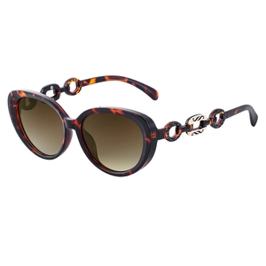 Cat-eye tortoiseshell sunglasses with metal chain temples and brown gradient lenses