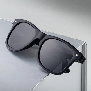 Modern square polarized sunglasses for men with black glossy frame and silver rivets