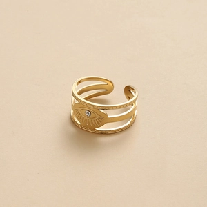 Detailed close-up of adjustable golden evil eye ring with three-layer hollow band and zircon