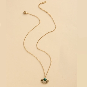 Detail of 14K gold plated titanium necklace with turquoise stone in fan-shaped pendant