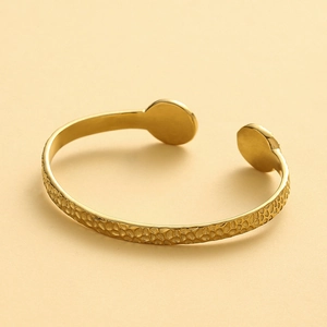Minimalist gold stainless steel hammered cuff bracelet with a polished open design