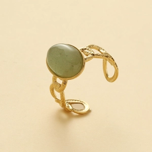 Gold hollow chain ring featuring a green oval gemstone with a vintage hammered finish