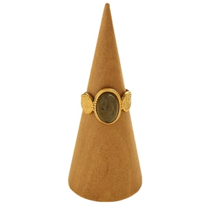 Golden open ring with oval olive green stone and hammered texture on wooden stand