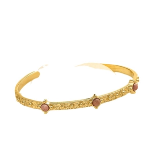Hammered gold stainless steel cuff bangle featuring three pink natural stone insets
