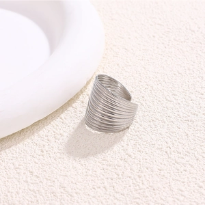 Minimalist silver multi-layer coiled hollow wavy ring with a modern textured finish
