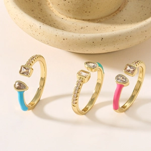 Detailed macro view of colorful enamel copper rings with inlaid sparkling zircons