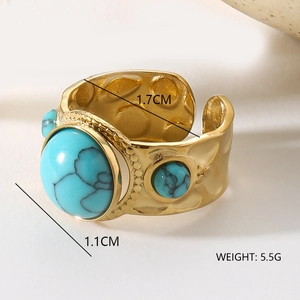 Macro view of vintage gold textured ring with three turquoise stones and size specs