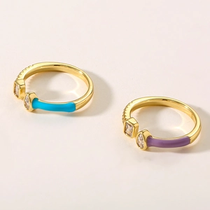 Detail of colorful enamel open rings with gold plating and cubic zirconia stones