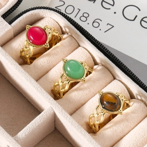 Detailed macro of vintage hollow rings with natural stones in a velvet box