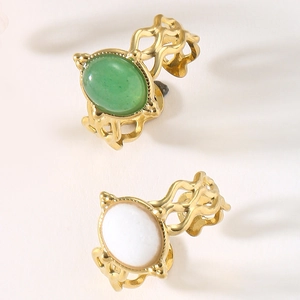 Detail of vintage open rings with hollow wavy bands and oval natural stone inlays