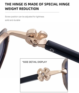 Detail of oval sunglasses featuring a golden clover hinge with sparkling zircon inlay